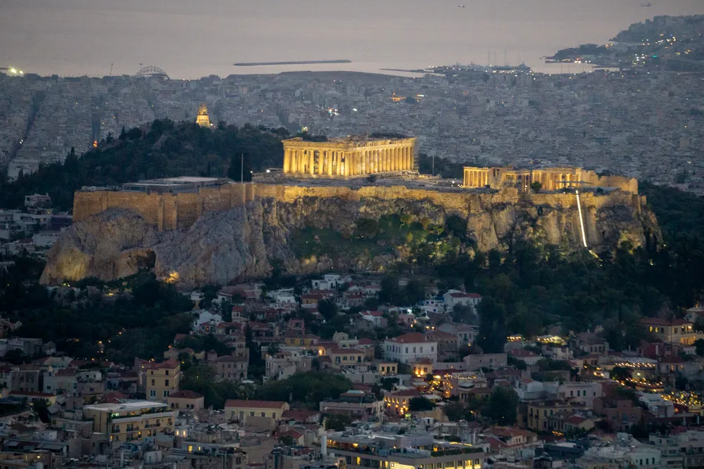 Akropolis bezoeken: tips voor je stedentrip Athene | Griekenland Akropolis in de avond - uitzicht vanaf Lycabettus Hill