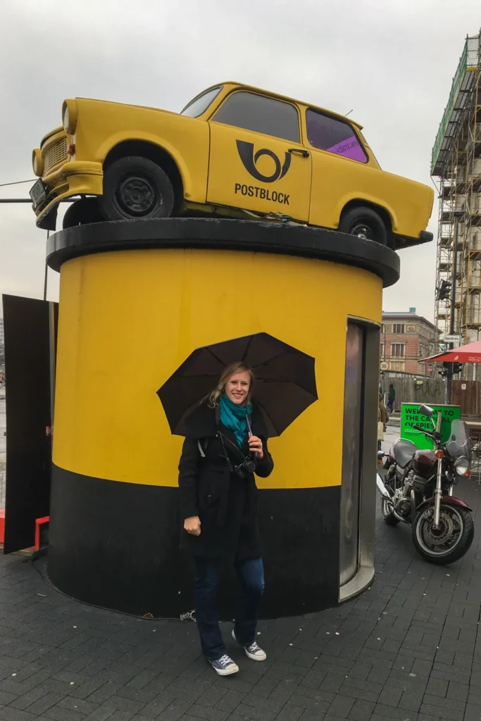 Things to do in Berlin when it rains: 9 tips for a wet city trip | Germany Co with an umbrella in Berlin